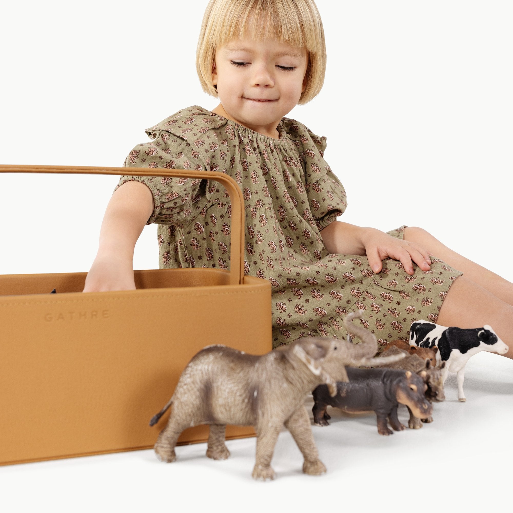 Camel@Kid playing with toys in the small camel caddy