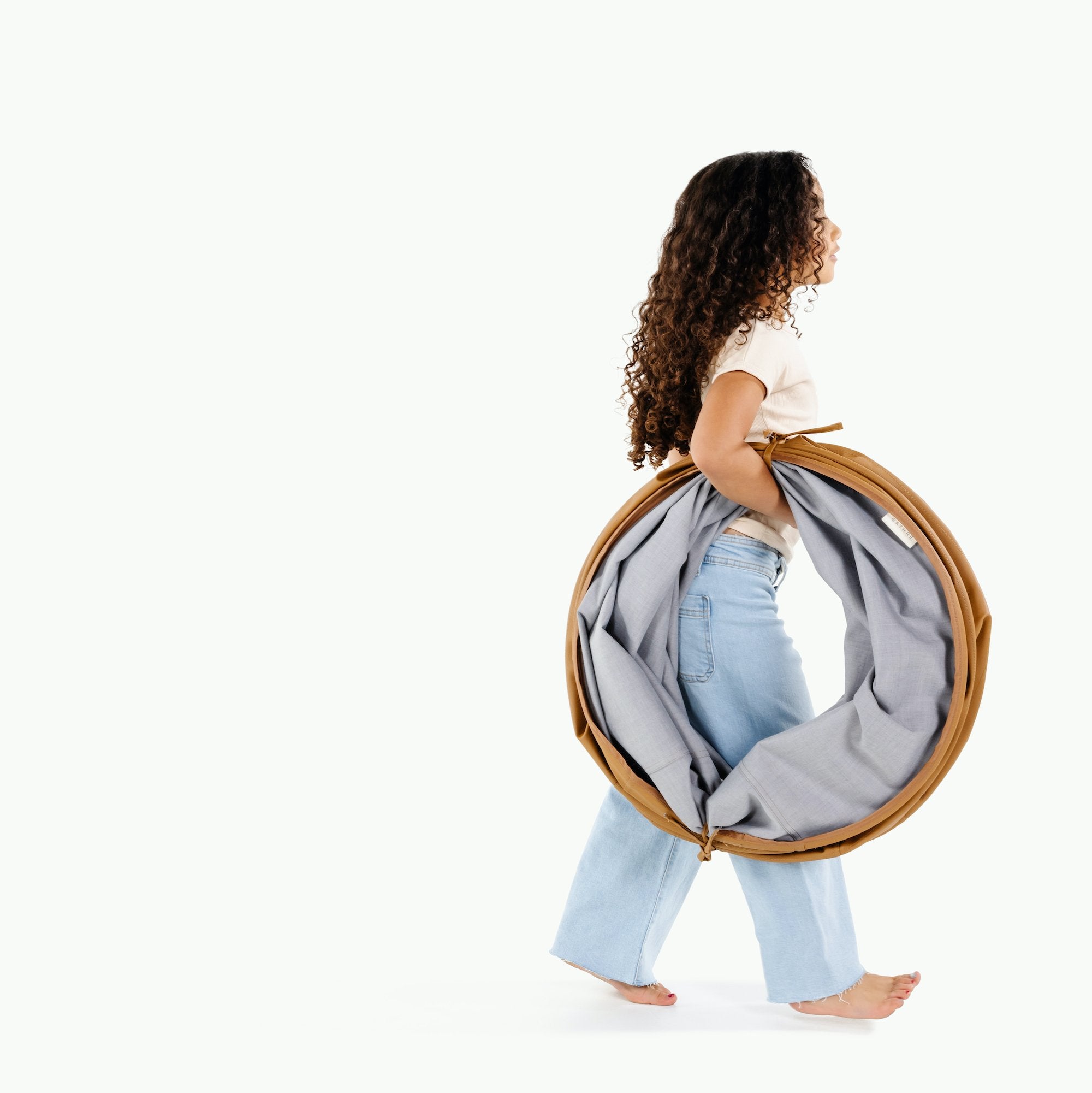 Camel@Kid holding the folded Camel Tunnel