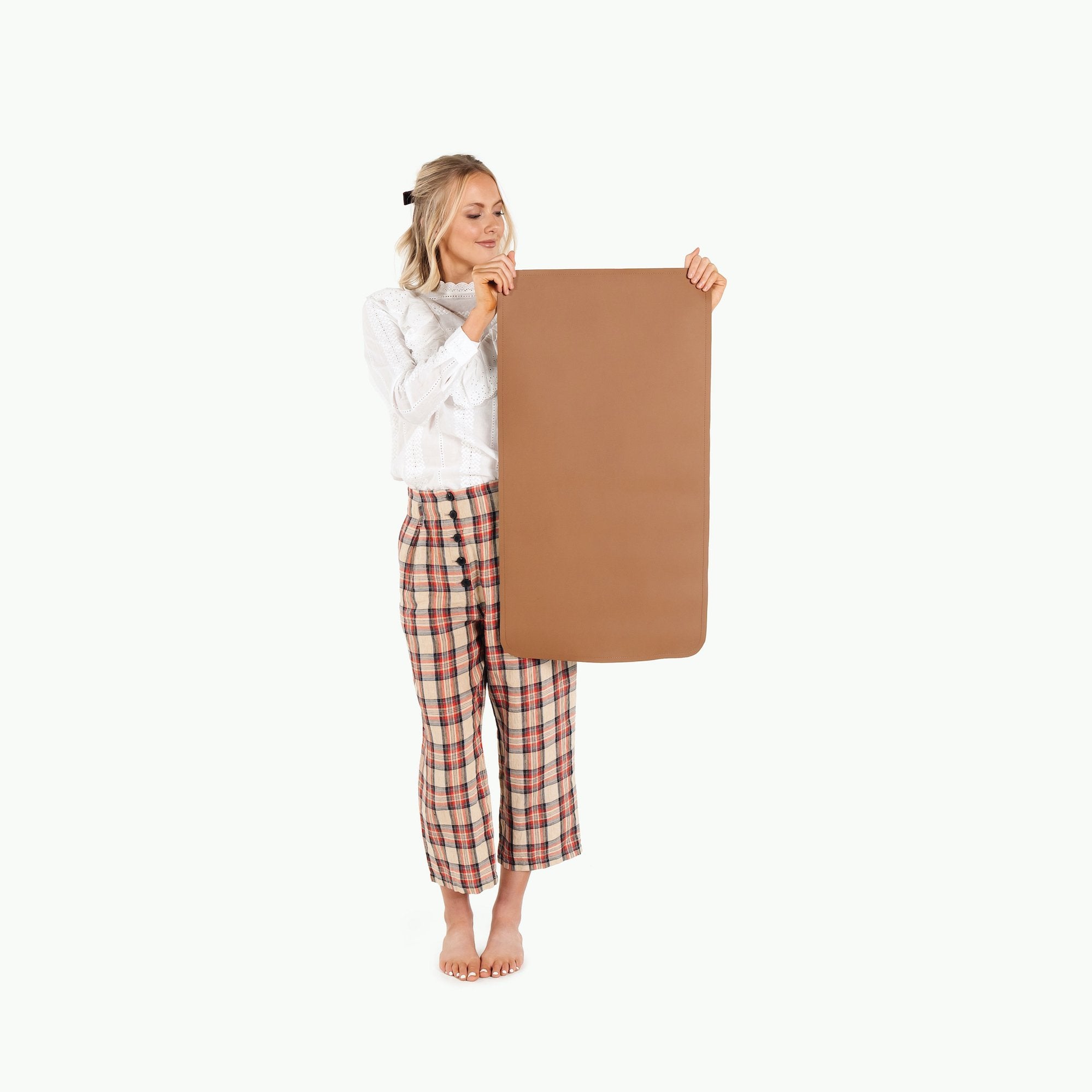 Cedar (on sale)@woman holding the cedar micro+ mat