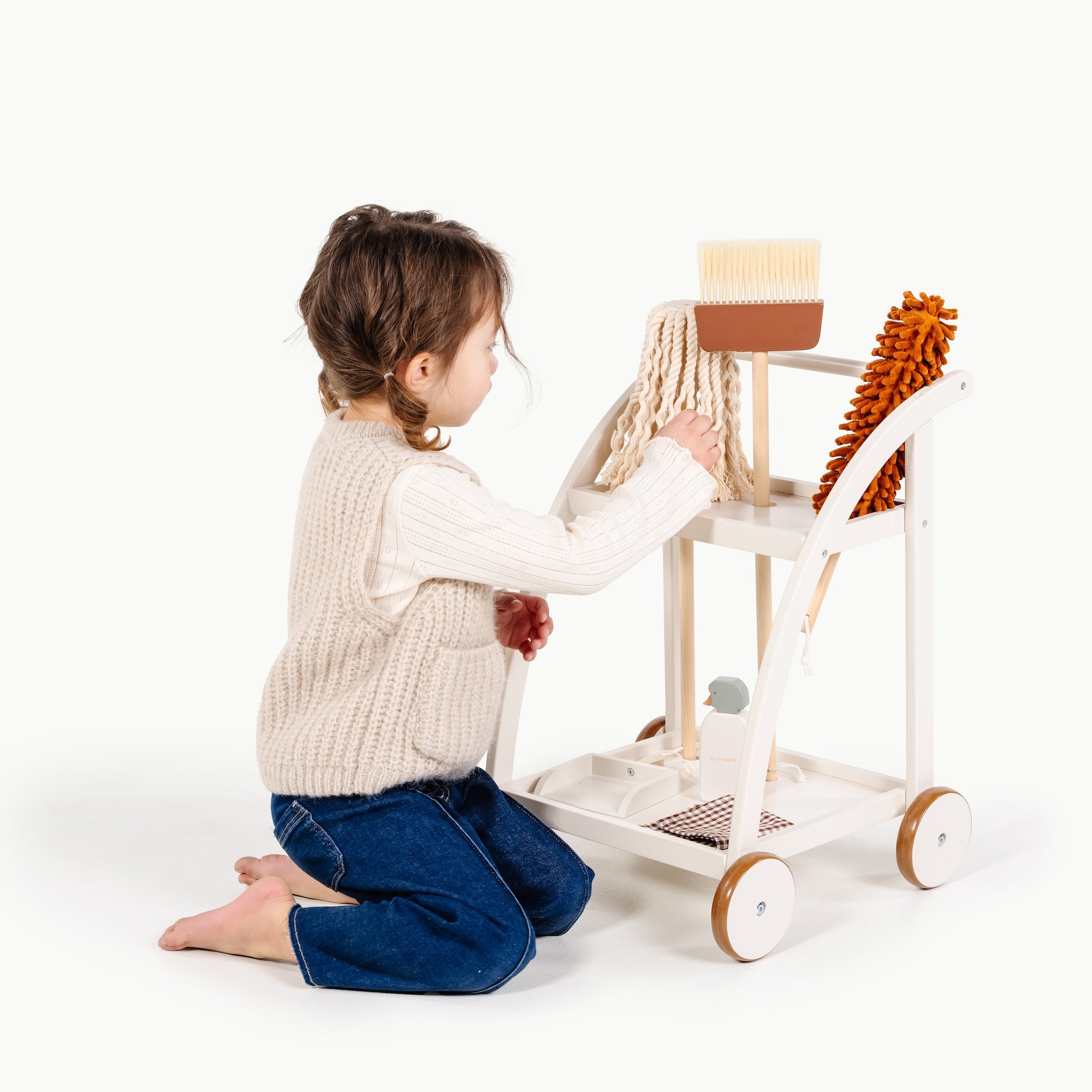 Ivory@little girl playing with the cleaning cart