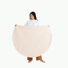 Pebble (on sale) / Circle@Woman holding the Pebble Midi Circle Mat