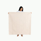 Pebble (on sale) / Square@Woman holding the Pebble Midi Square Mat