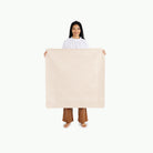 Pebble (on sale)@Woman holding the Pebble Mini Mat