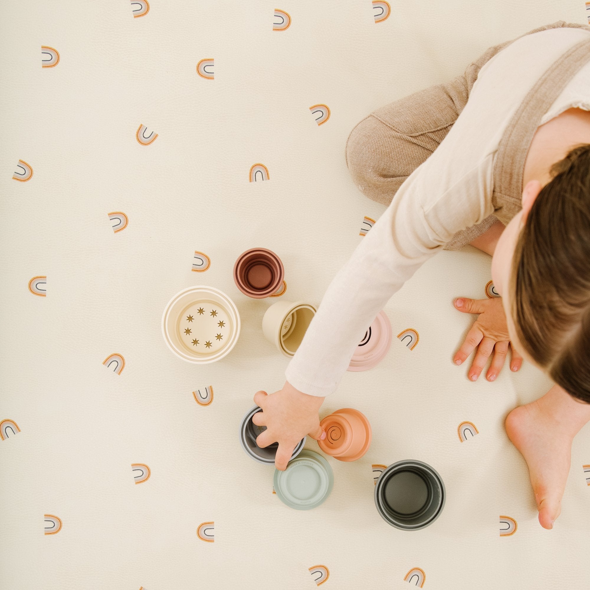 Tiny Rainbow (on sale)@Overhead of kid playing on the Tiny Rainbow Midi+ Mat