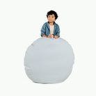 Dawn (on sale) / Circle@Kid holding the Dawn Circle Floor Cushion