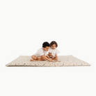 Dinosauria@kids playing on mat