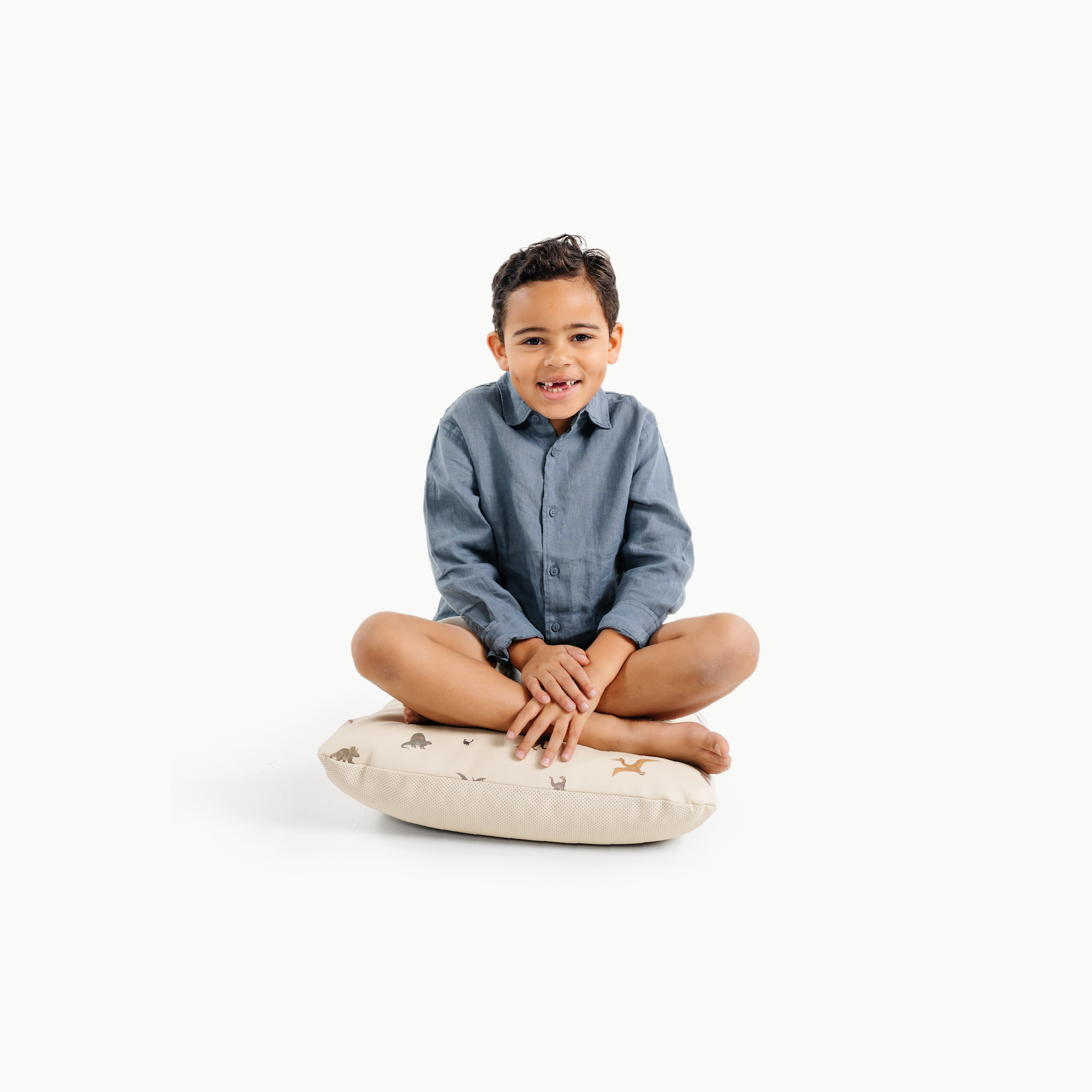 Dinosauria (on sale) / Square@little boy sitting on a mini cushion