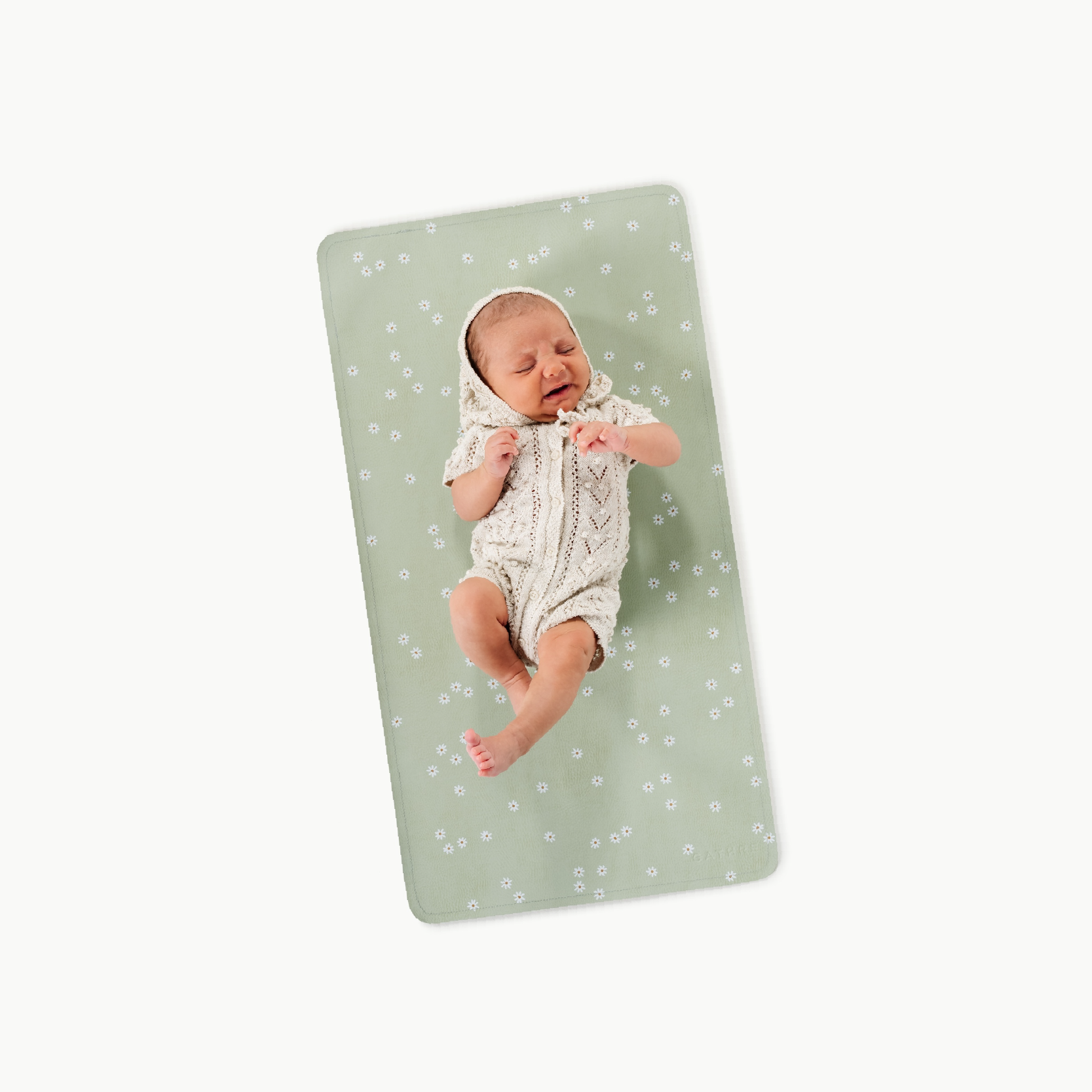 Flora@baby lying on a micro changing mat