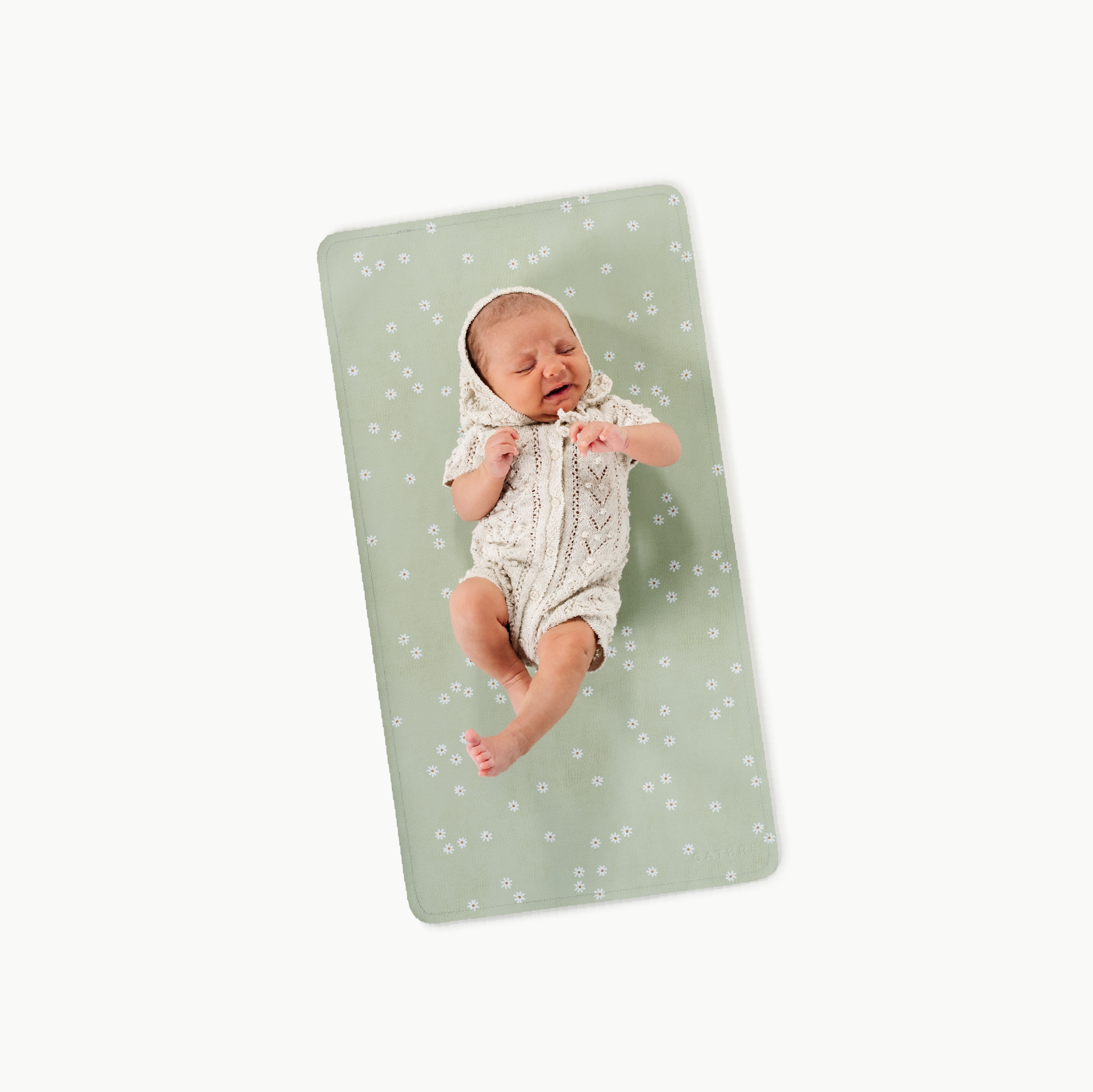 Flora@baby lying on a micro changing mat