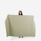 Laurel (on sale) / 6 Foot@women holding up the laurel 6 foot tablecloth