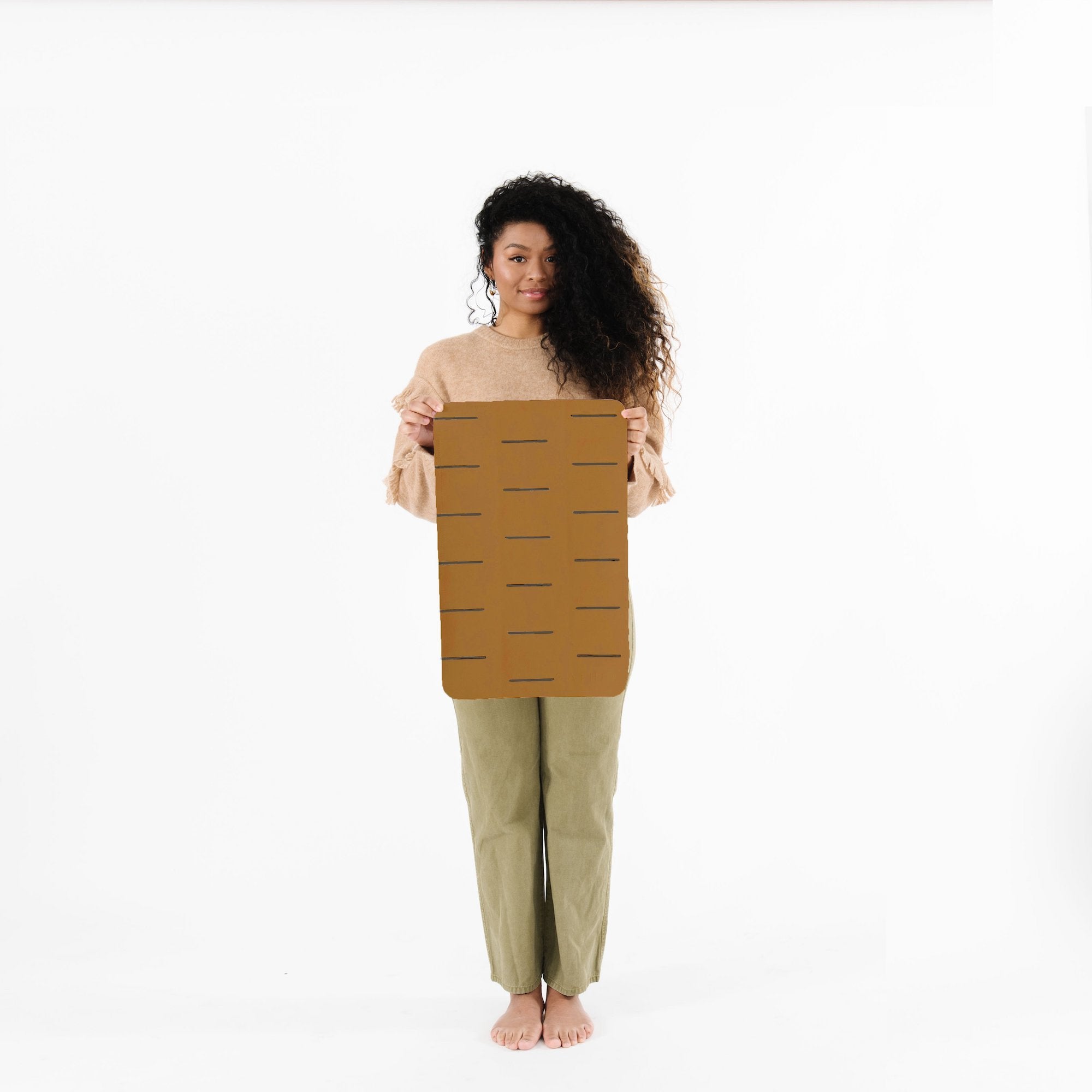 Camel Dash (on sale)@Woman holding the Camel Dash Micro Mat