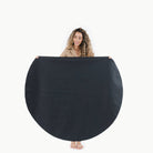 Raven (on sale) / Circle@Woman holding the Raven Circle Midi Mat