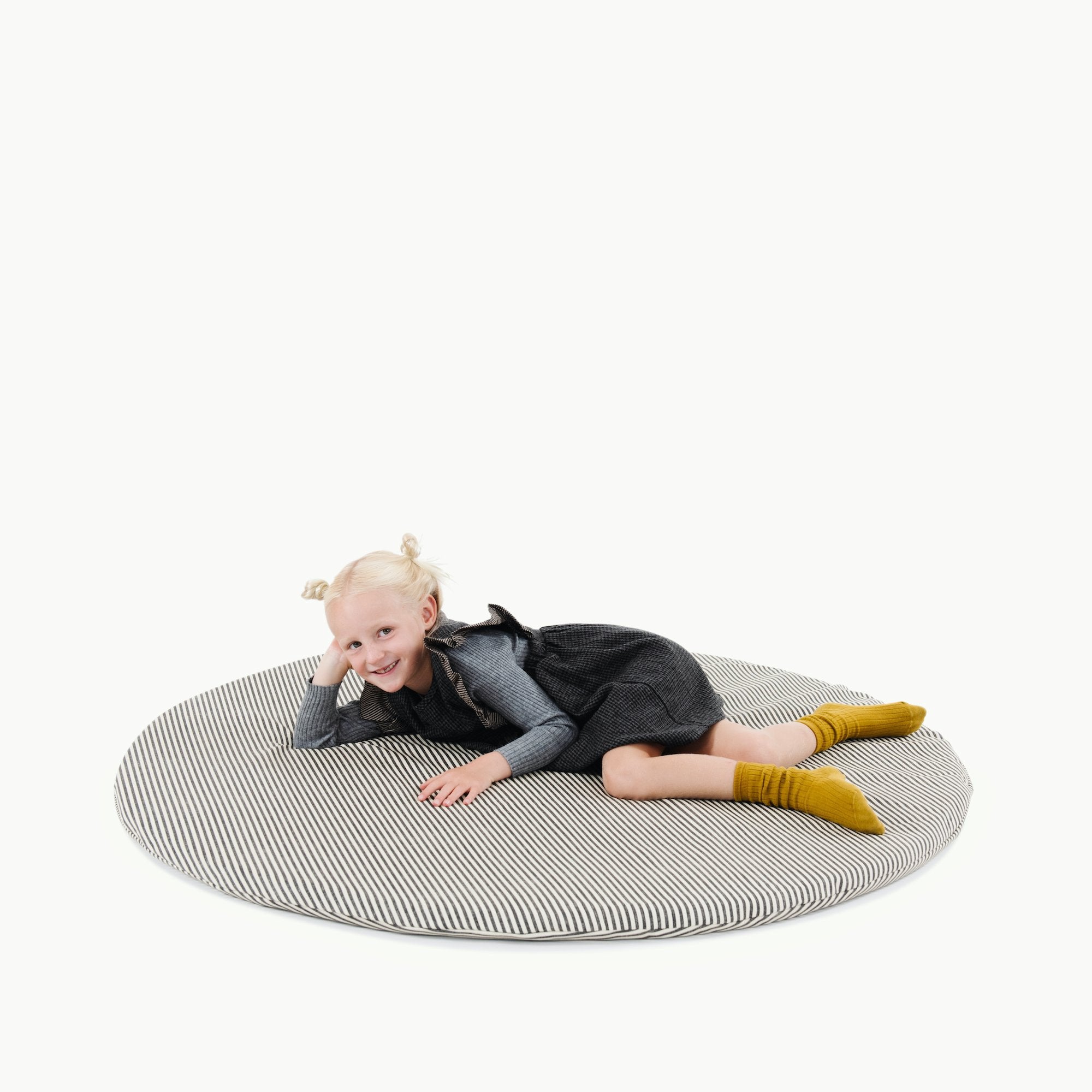 Stone Stripe@Kid laying on Stone Stripe padded midi circle