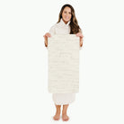 Cantata (on sale)@Woman holding the Cantata Micro+ Mat