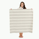 Pencil Stripe (on sale)@Woman holding the Pencil Stripe Mini Mat