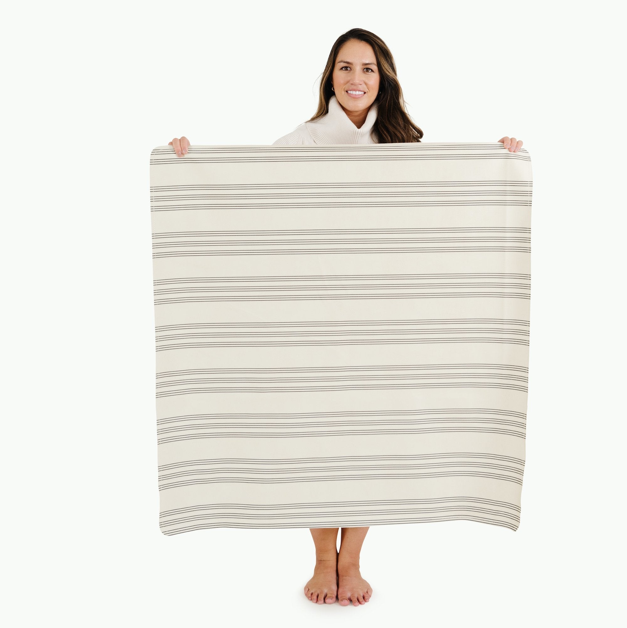 Pencil Stripe (on sale)@Woman holding the Pencil Stripe Mini Mat