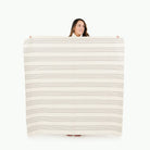 Pencil Stripe (on sale) / Square@Woman holding the Pencil Stripe Midi Square Mat