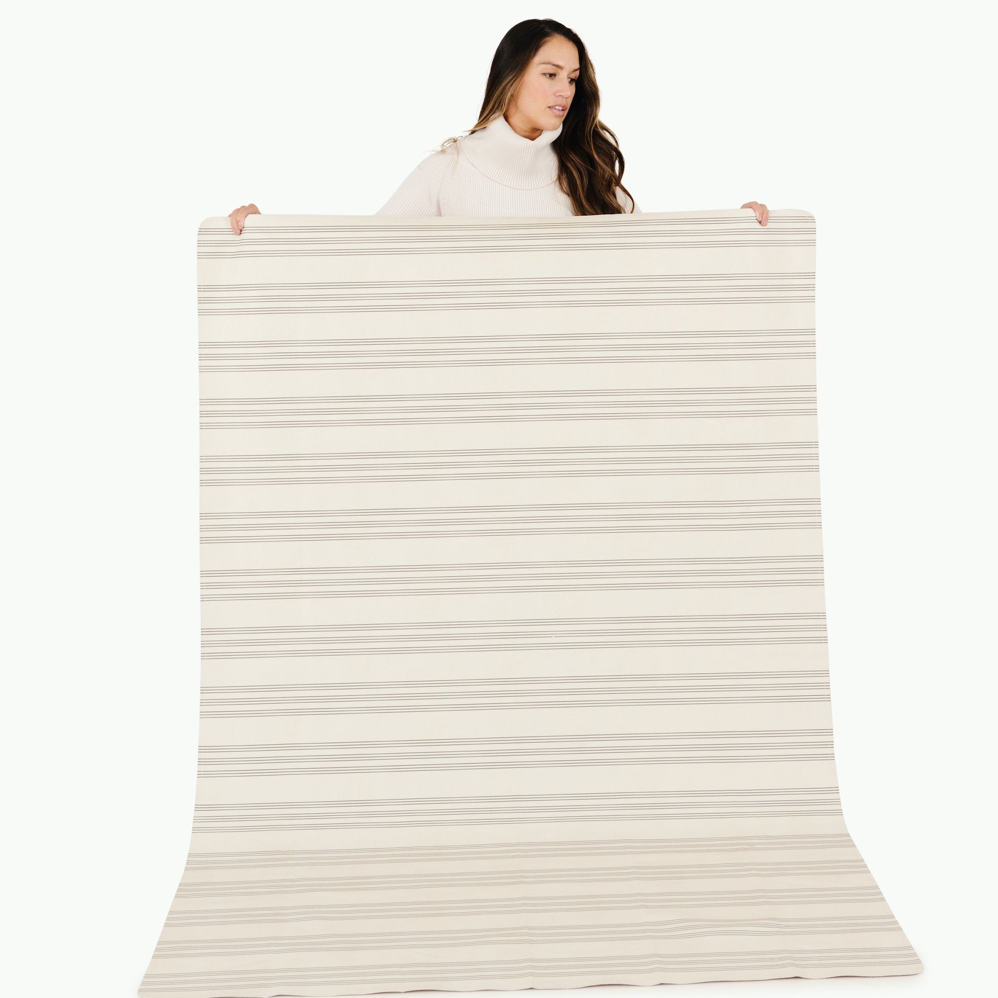 Pencil Stripe (on sale)@Woman holding the Pencil Stripe Midi+ Mat