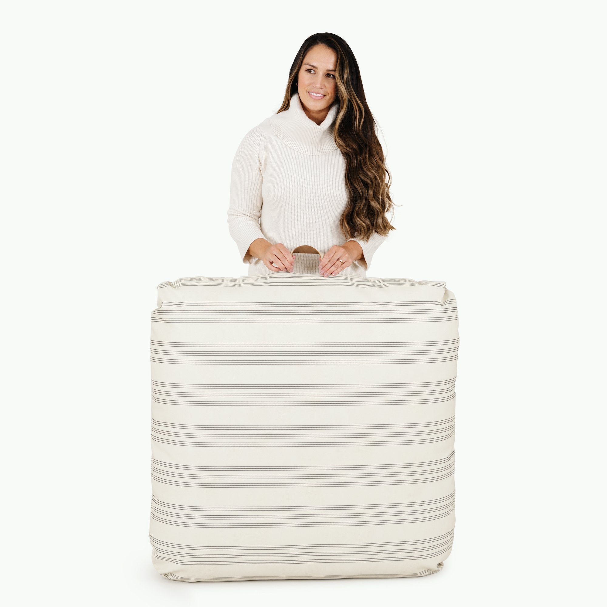 Pencil Stripe (on sale) / Square@Woman holding the Pencil Stripe Square Floor Cushion