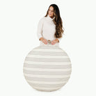 Pencil Stripe (on sale) / Circle@Woman holding the Pencil Stripe Circle Floor Cushion