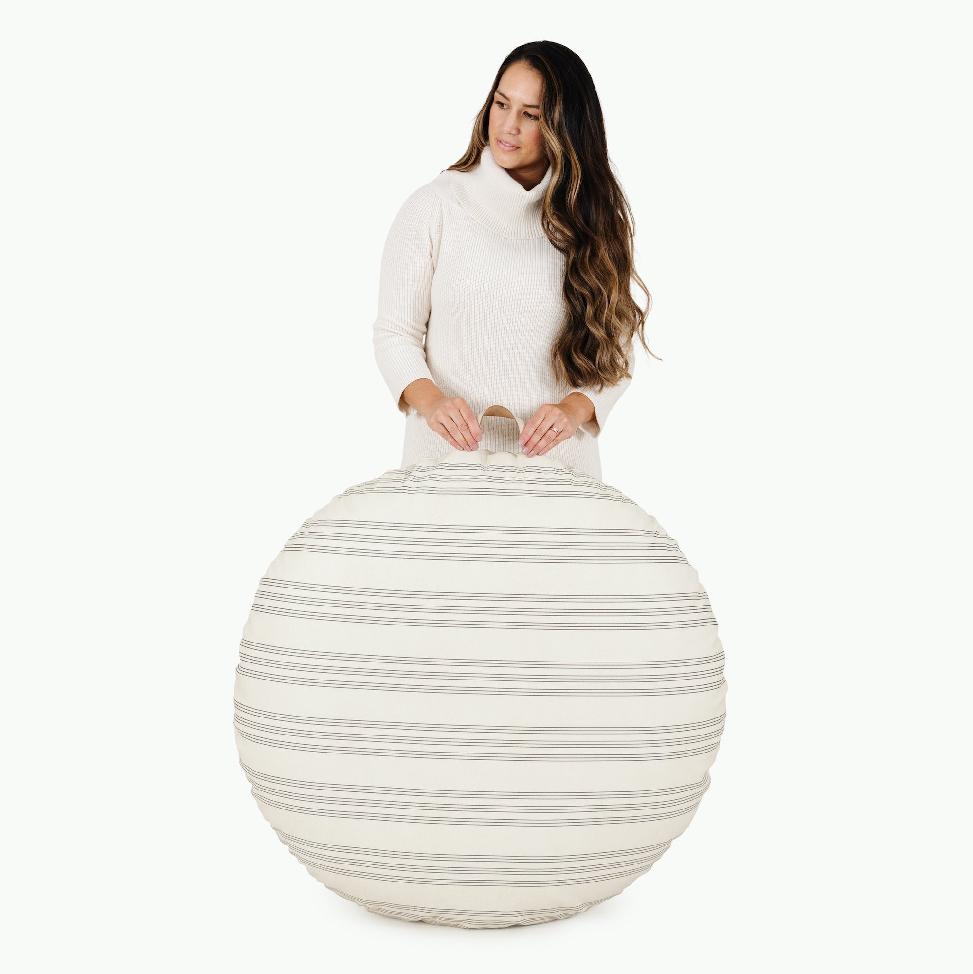 Pencil Stripe (on sale) / Circle@Woman holding the Pencil Stripe Circle Floor Cushion