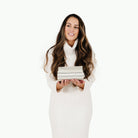 Pencil Stripe (on sale)@Woman holding a folded Pencil Stripe Mini Mat