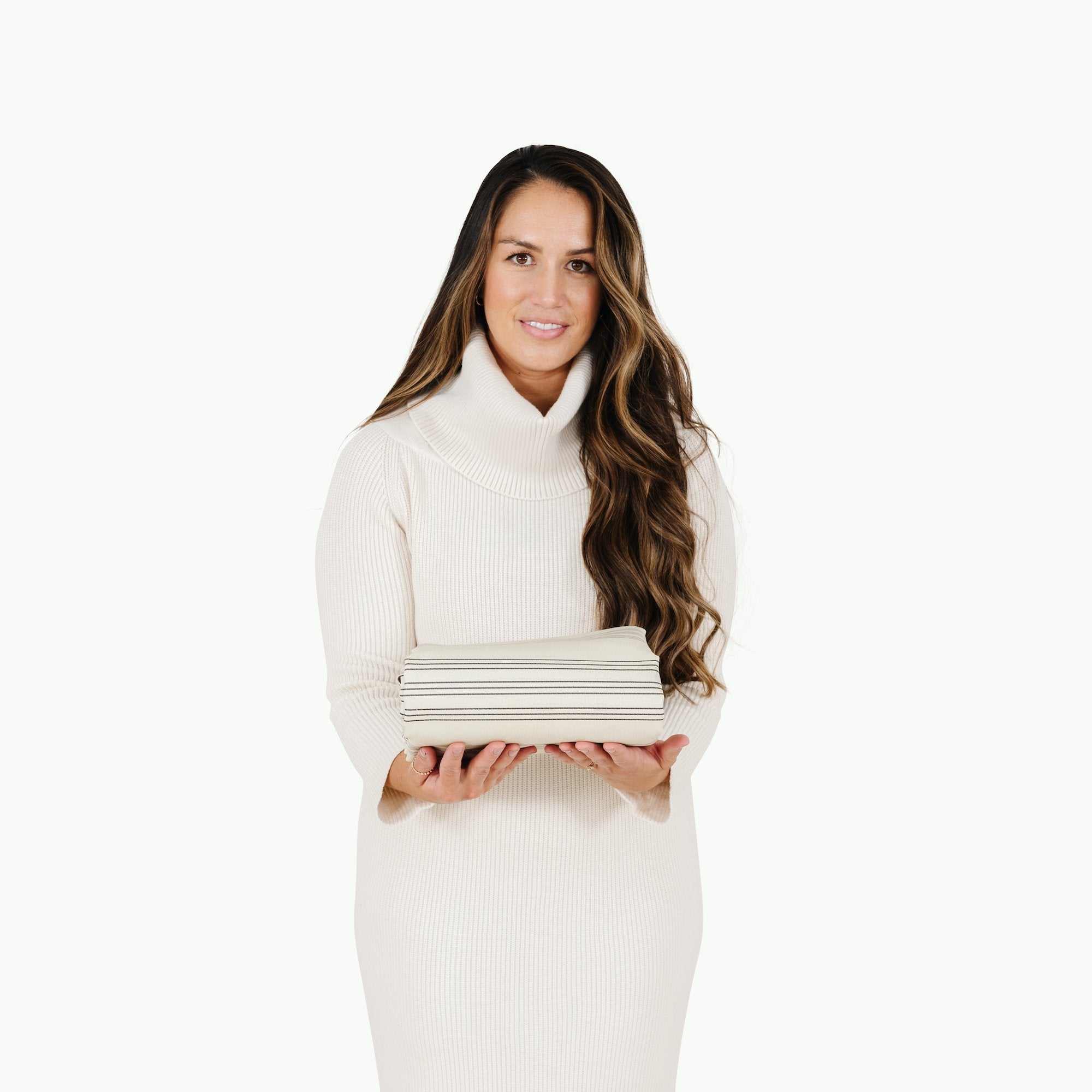 Pencil Stripe (on sale)@Woman holding the folded Pencil Stripe Midi+ Mat