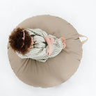 Ember (on sale) / Circle@Overhead of kid sitting on the Ember Circle Floor Cushion