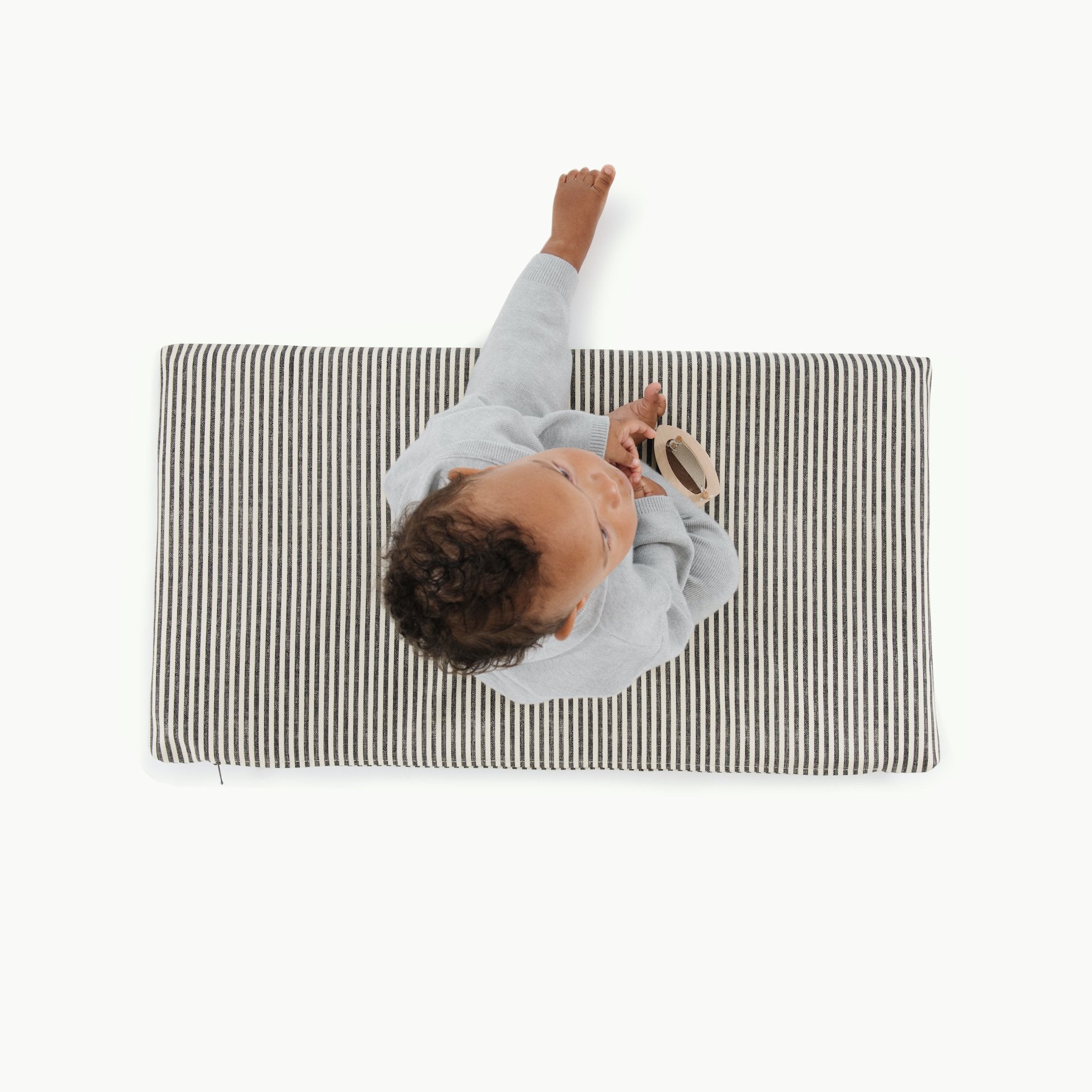 Stone Stripe@Overhead kid sitting on stone stripe padded micro+