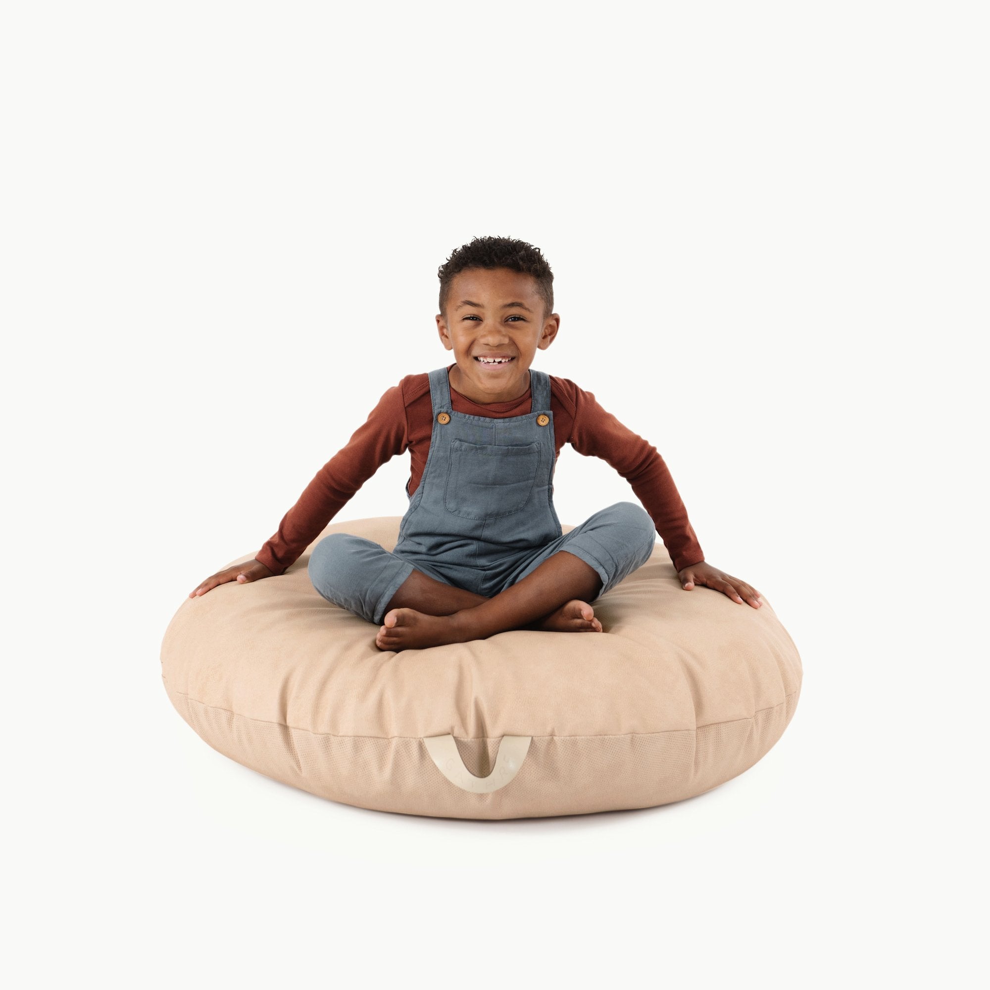 Untanned (on sale) / Circle@Kid sitting on the Untanned Circle Floor Cushion