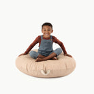 Untanned (on sale) / Circle@Kid sitting on the Untanned Circle Floor Cushion