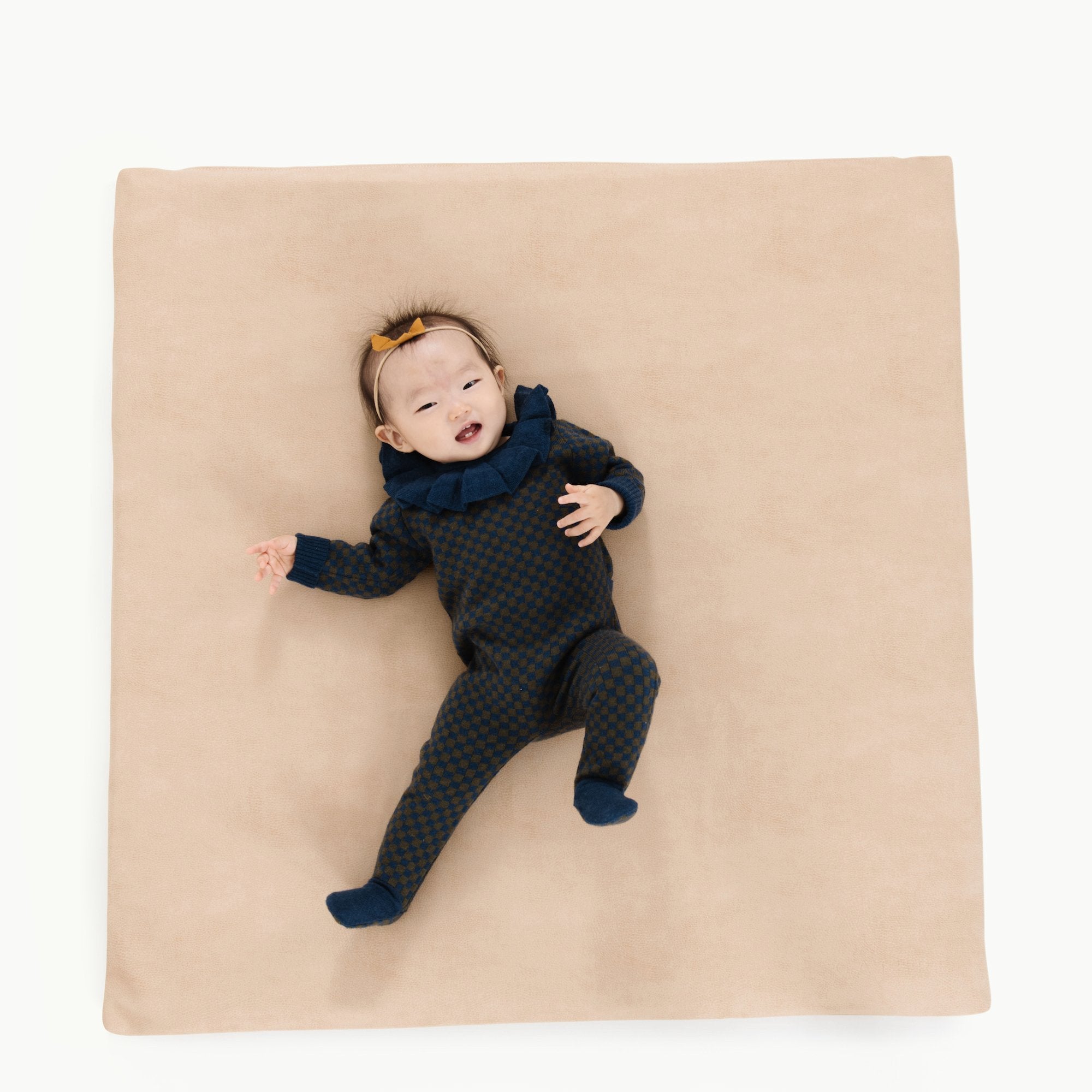 Untanned (on sale) / Square@Overhead image of baby laying on Untanned Padded Mini Square