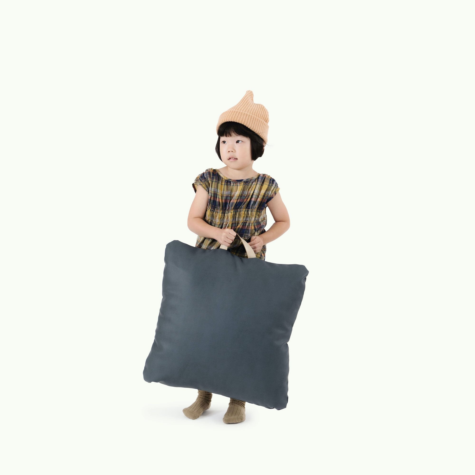 Nightfall (on sale) / Square@Kid holding the Nightfall Square Mini Floor Cushion