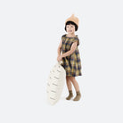 Blanc Dash (on sale) / Square@Kid holding the Blanc Dash Square Mini Floor Cushion