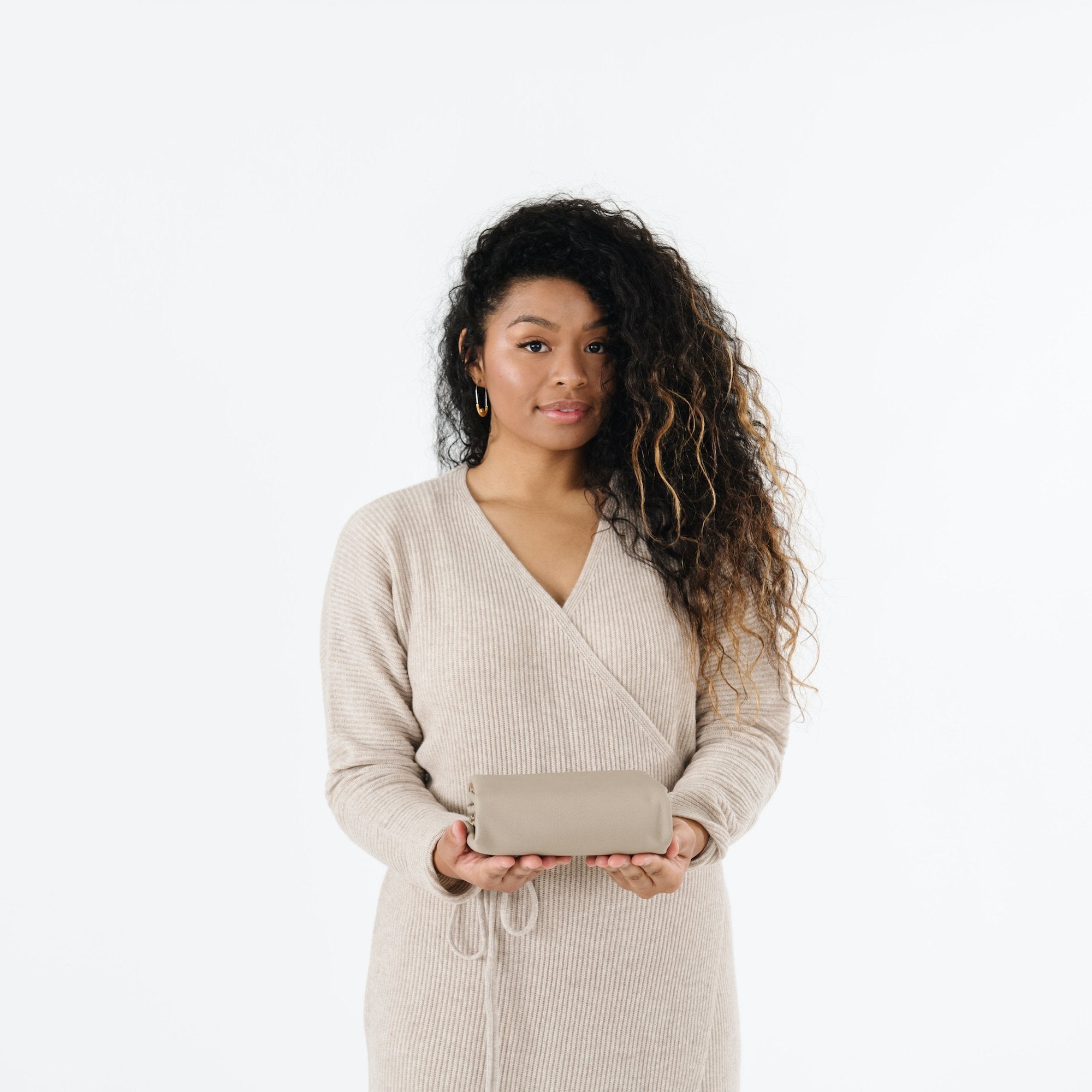 Ember (on sale)@Woman holding a folded Ember Mini Mat