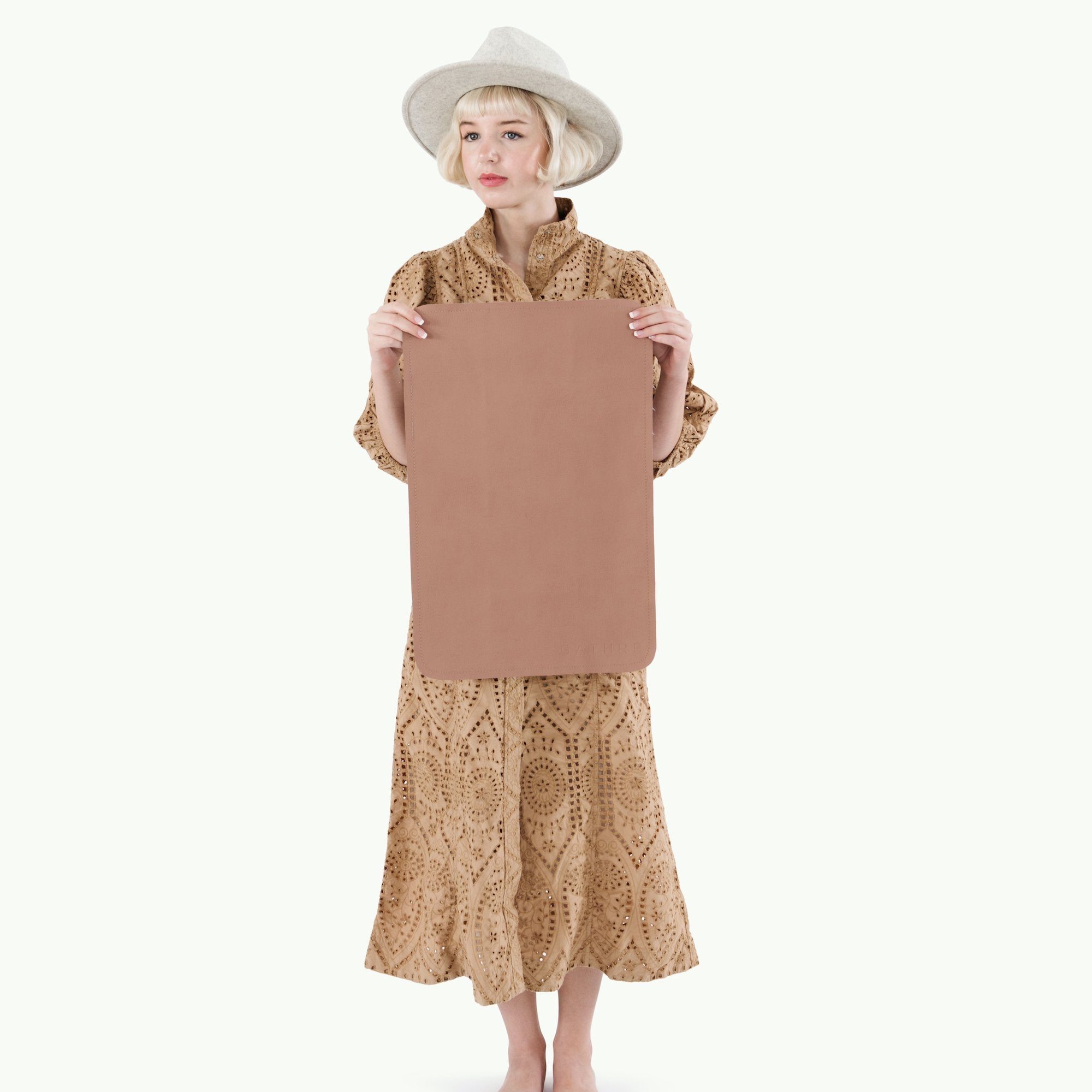 Sienna (on sale)@Woman holding the Sienna Micro Mat