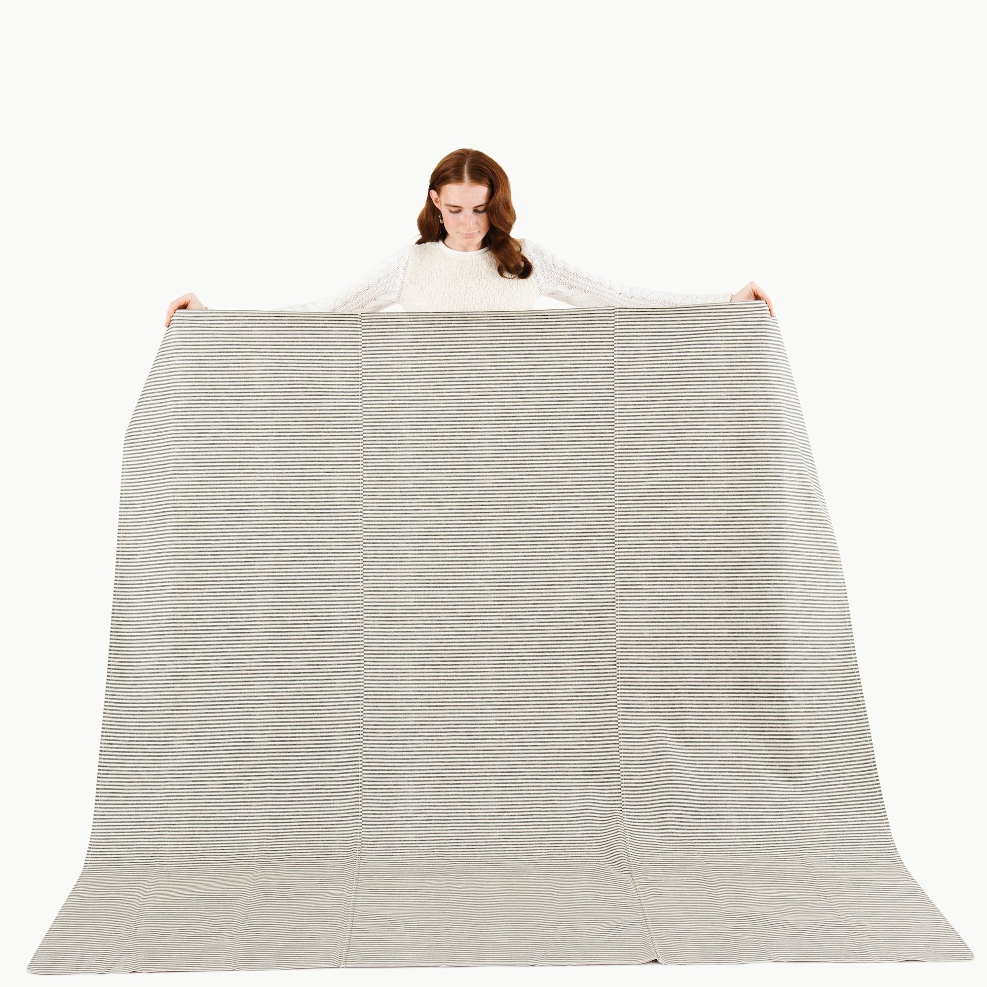 Stone Stripe / Square@Woman holding the Stone Stripe Maxi Mat