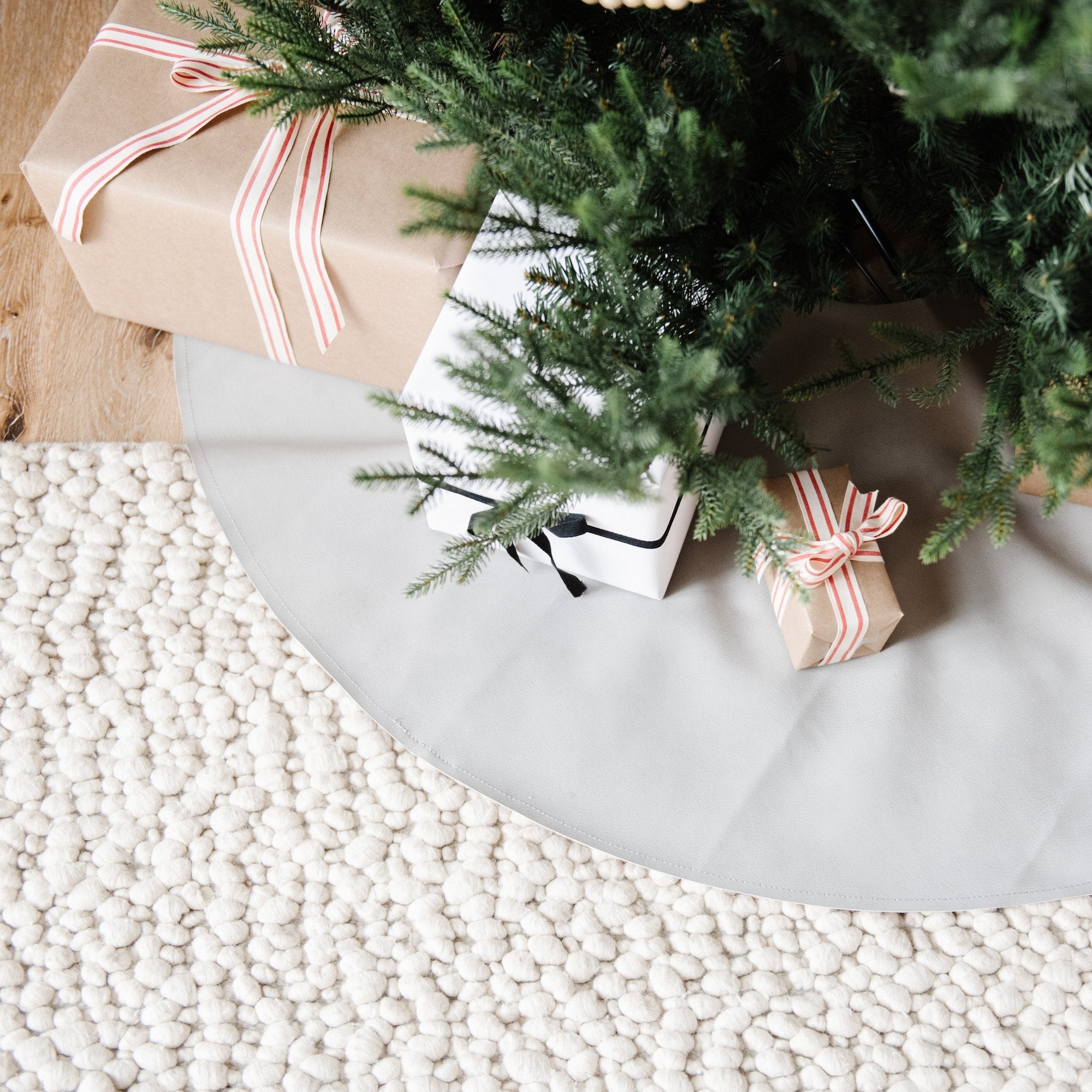 Pewter (on sale)@pewter tree skirt under christmas tree with presents on top