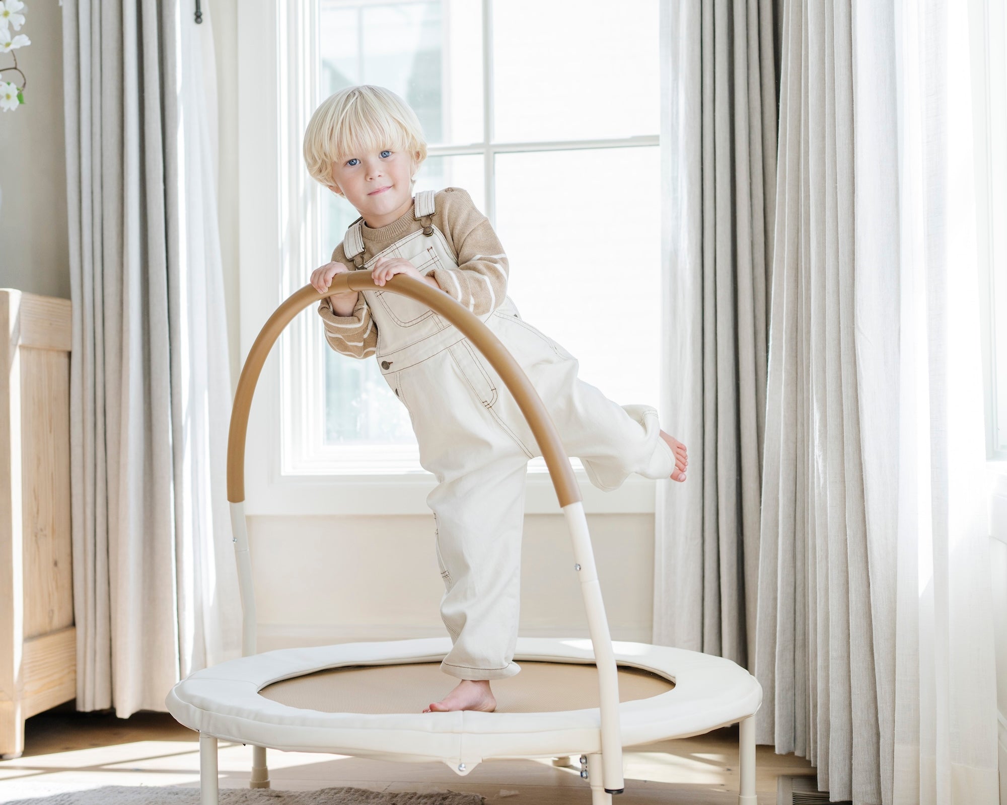 Ivory@lifestyle image of boy jumping on trampoline