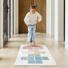 Rainbow Hopscotch@kid playing on the rainbow hopscotch home mat
