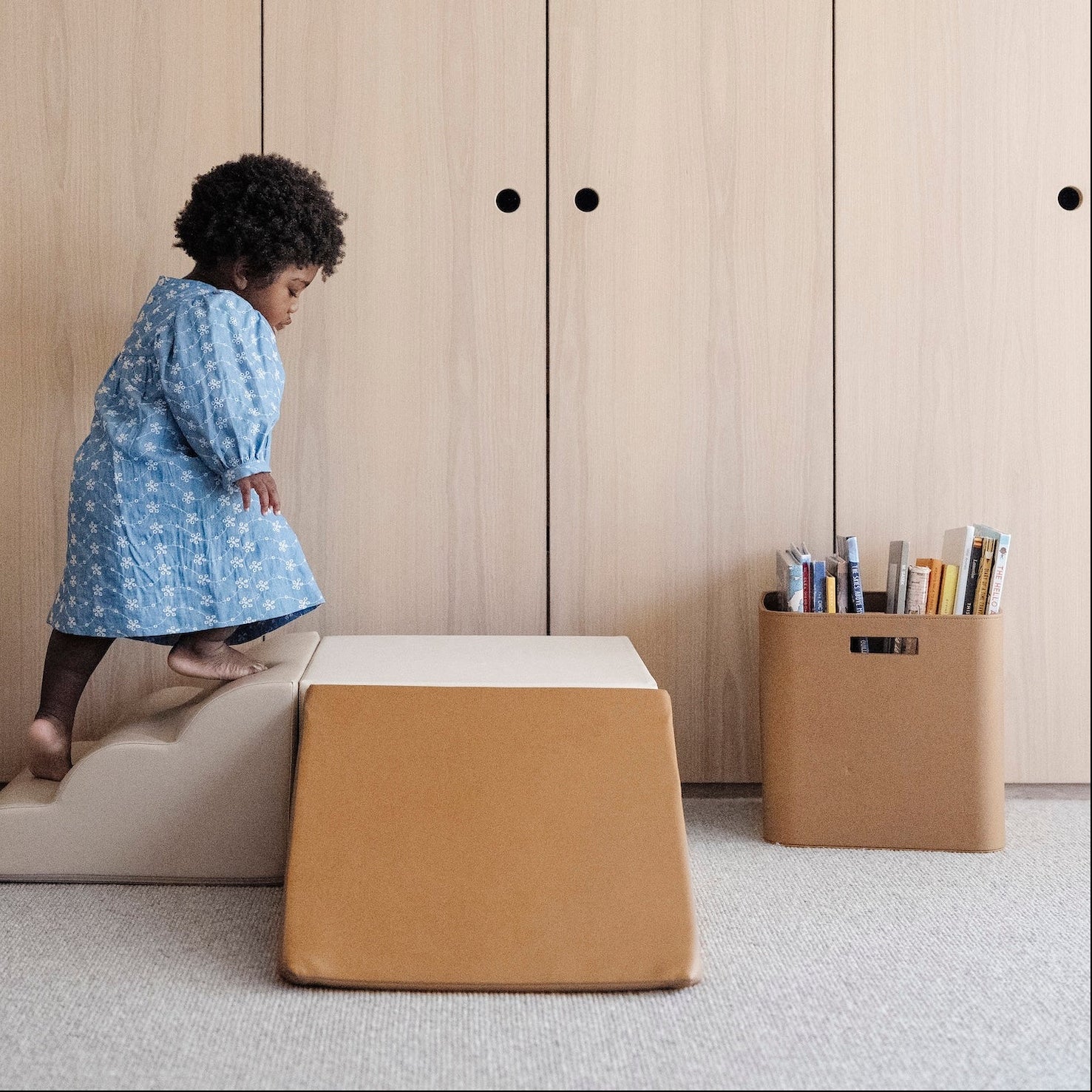 kid playing on the mini climber playset