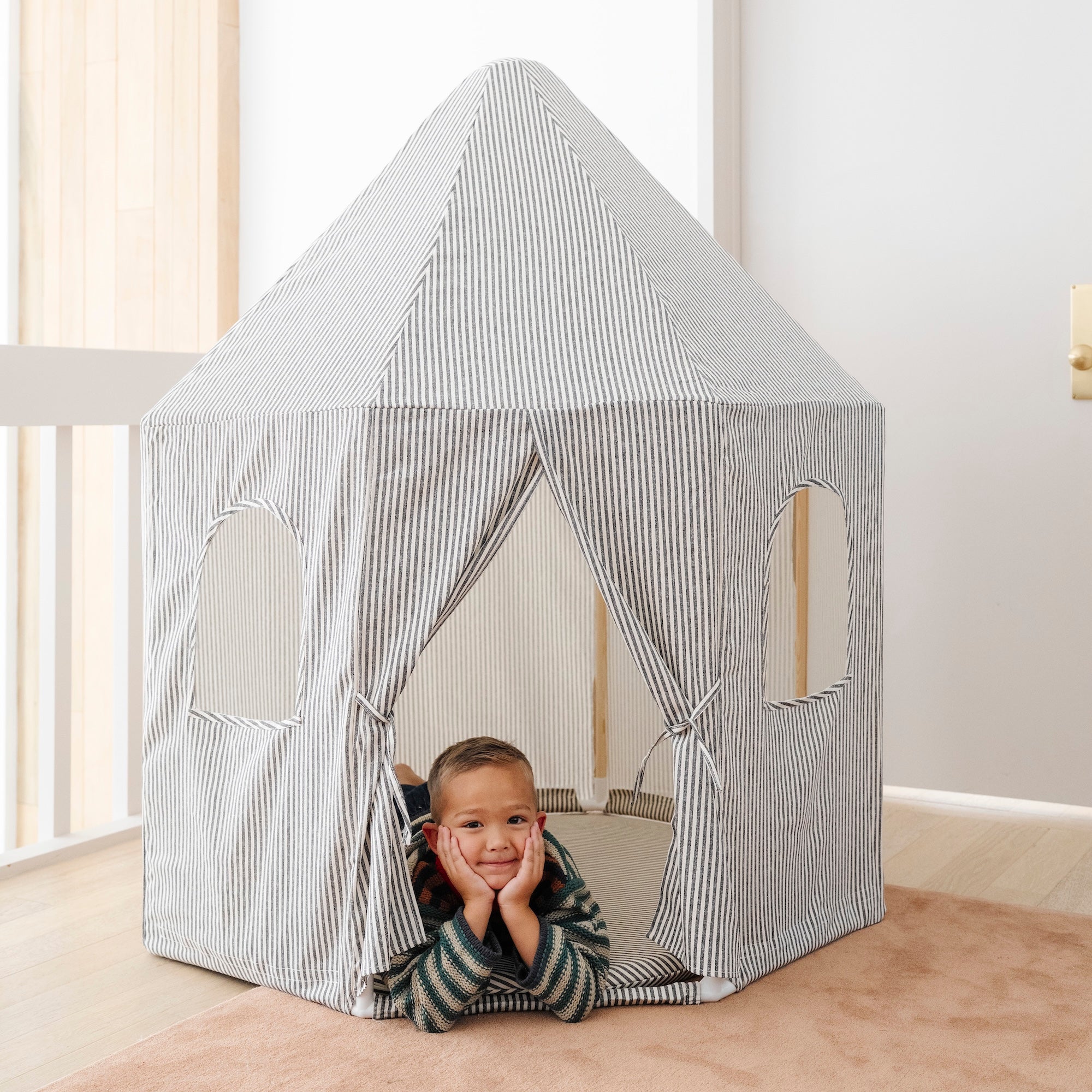 Stone Stripe@little boy playing in tent