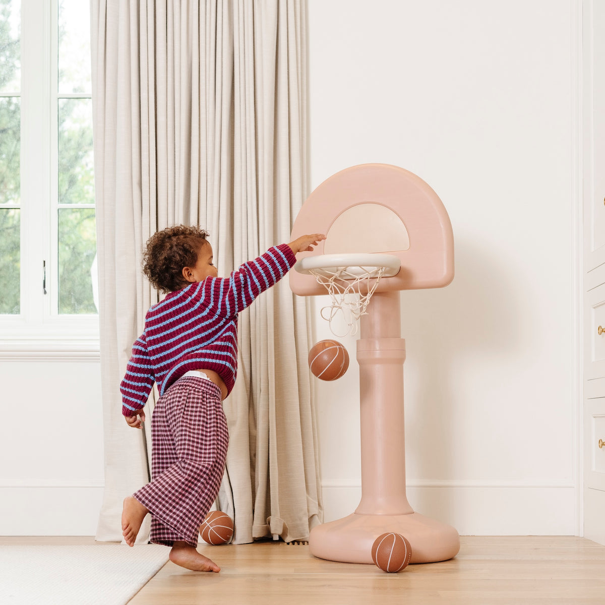Tulle@Toddler playing with Toddler basketball hoop designed for indoor and outdoor play