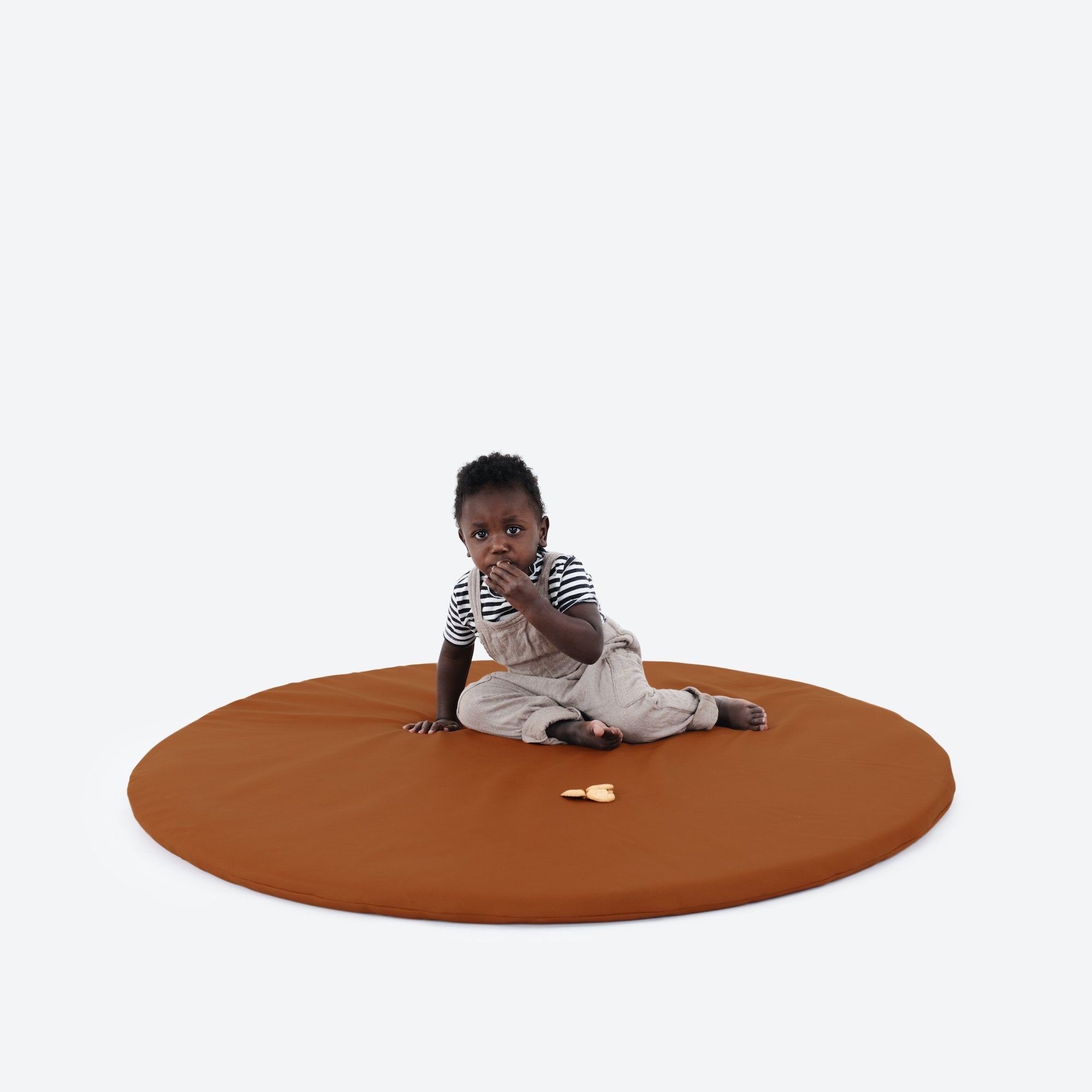 Ginger (on sale)@boy sitting on ginger padded midi circle