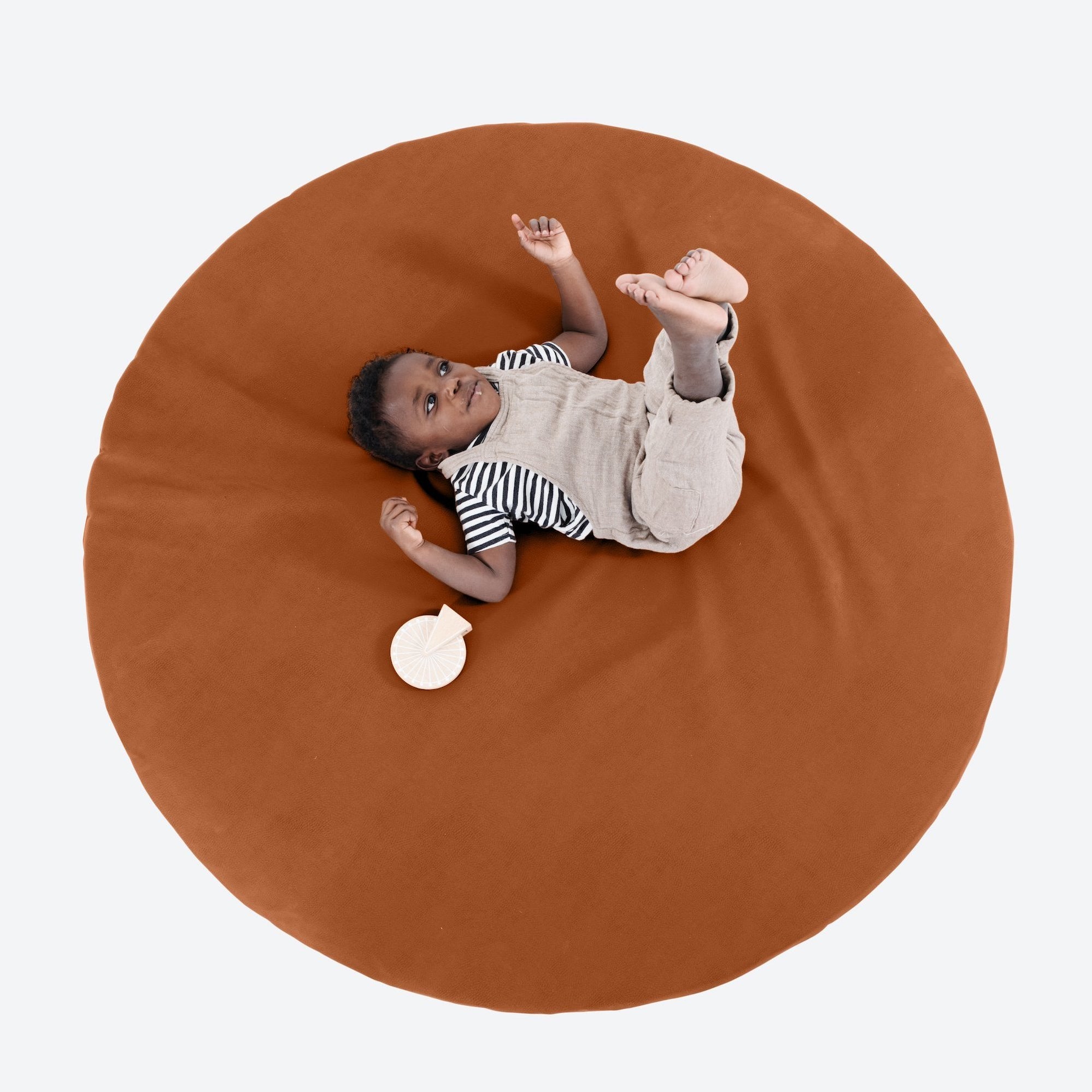 Ginger (on sale)@Boy laying on ginger padded midi circle
