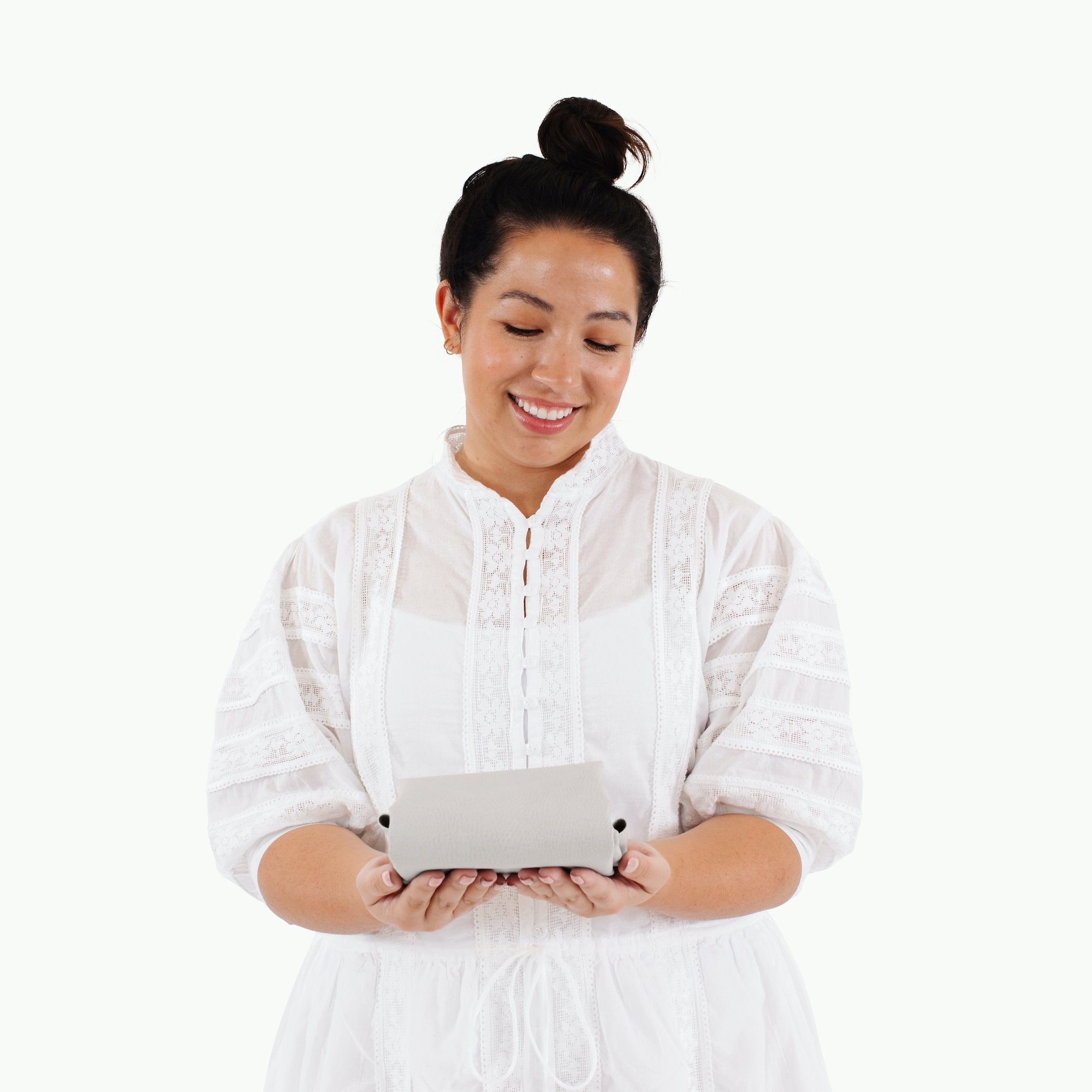 Gull (on sale)@Woman holding a folded Gull Micro Mat