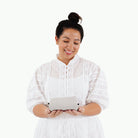 Gull (on sale)@Woman holding a folded Gull Micro Mat