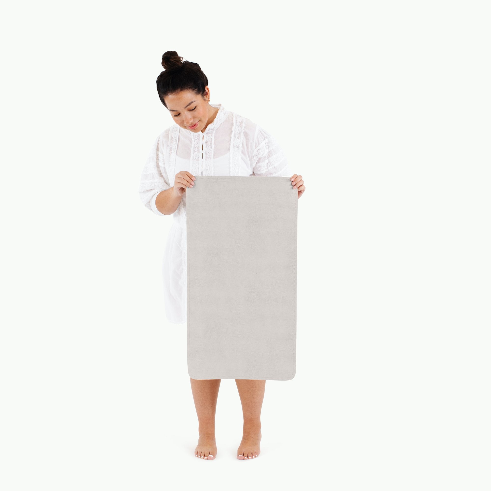 Gull (on sale)@Woman holding the Gull Micro+ Mat