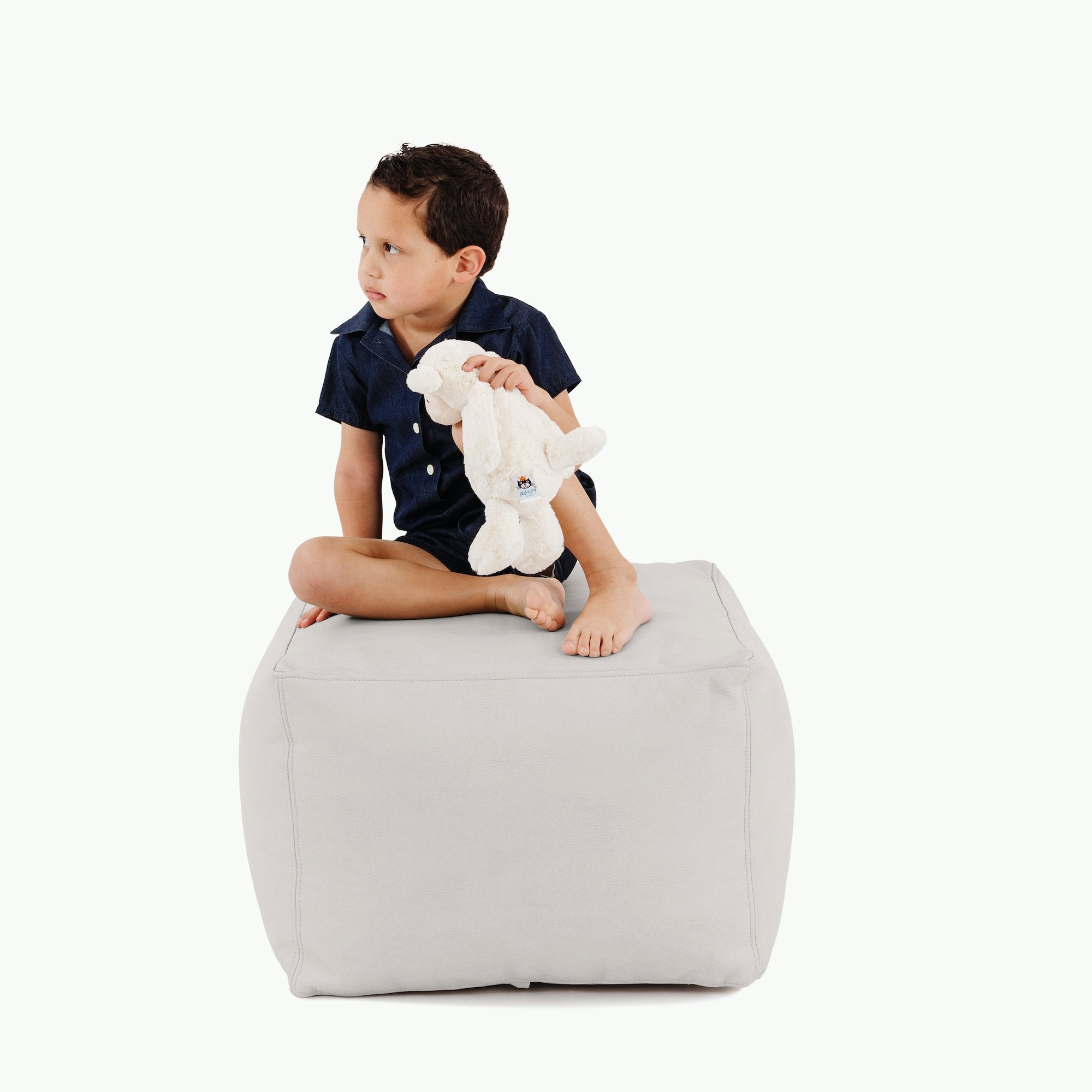 Pewter (on sale)@kid sitting on the pewter square pouf