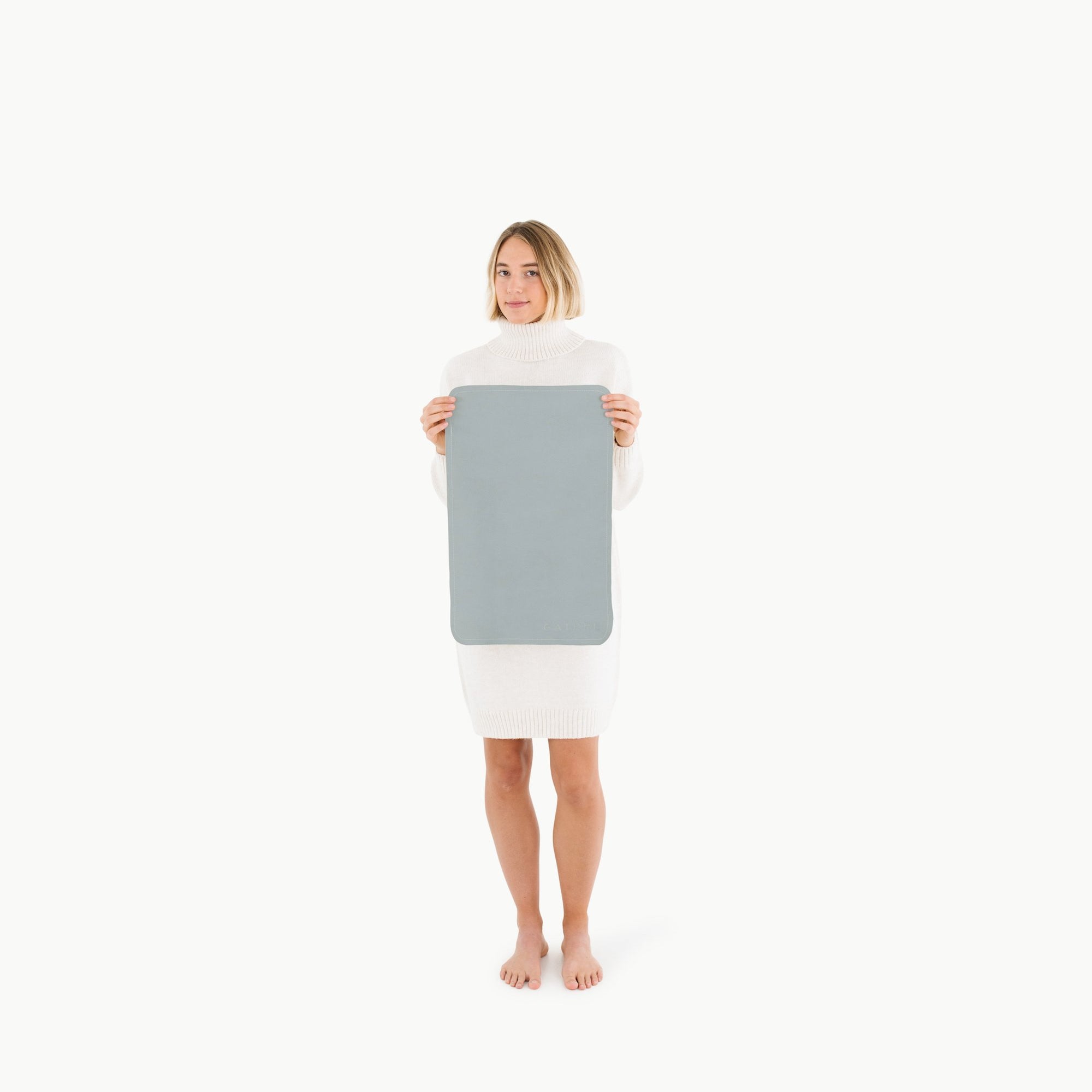 Heron (on sale)@Woman holding the Micro Heron Mat
